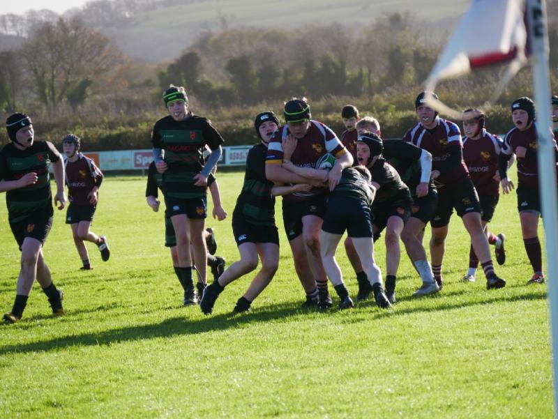 Youth rugby players in action